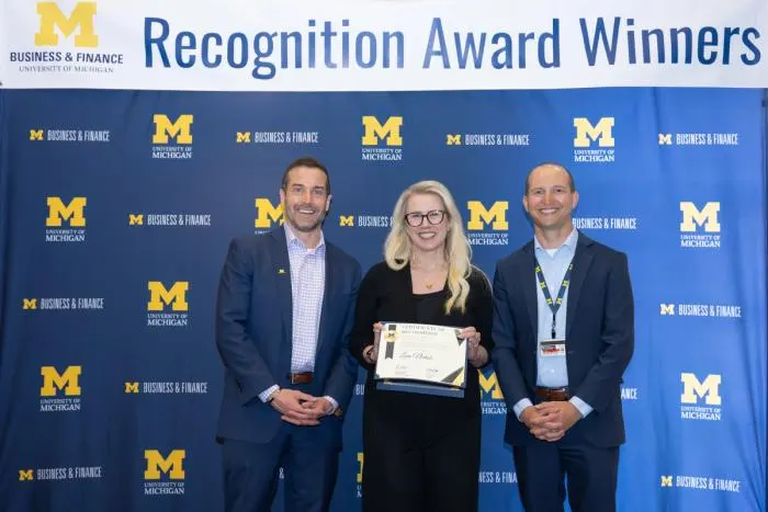 Recognition recipients accepting award