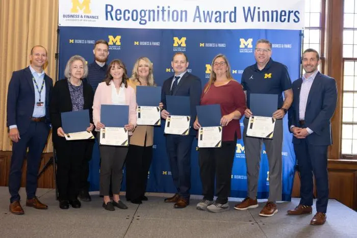 Recognition recipients accepting award