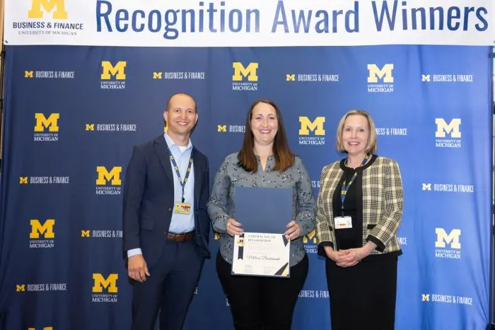 Recognition recipients accepting award